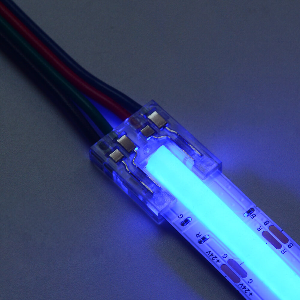 A blue led strip FEED CONNECTOR with wires attached to it.